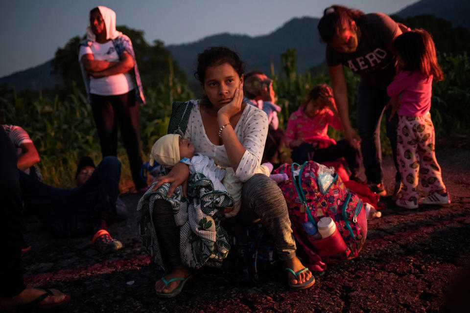 <p>A migrant woman rests roadside with her child while traveling with a caravan of thousands from Central America en route to the U.S. as they make their way to Mapastepec from Huixtla, Mexico, Oct. 24, 2018. (Photo: Adrees Latif/Reuters) </p>