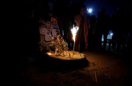 People participate in a symbolic birthday party for Palestinian boy Hussein Madi, who was killed at the Israel-Gaza border, at a tent city protest east of Gaza City April 9, 2018. REUTERS/Mohammed Salem