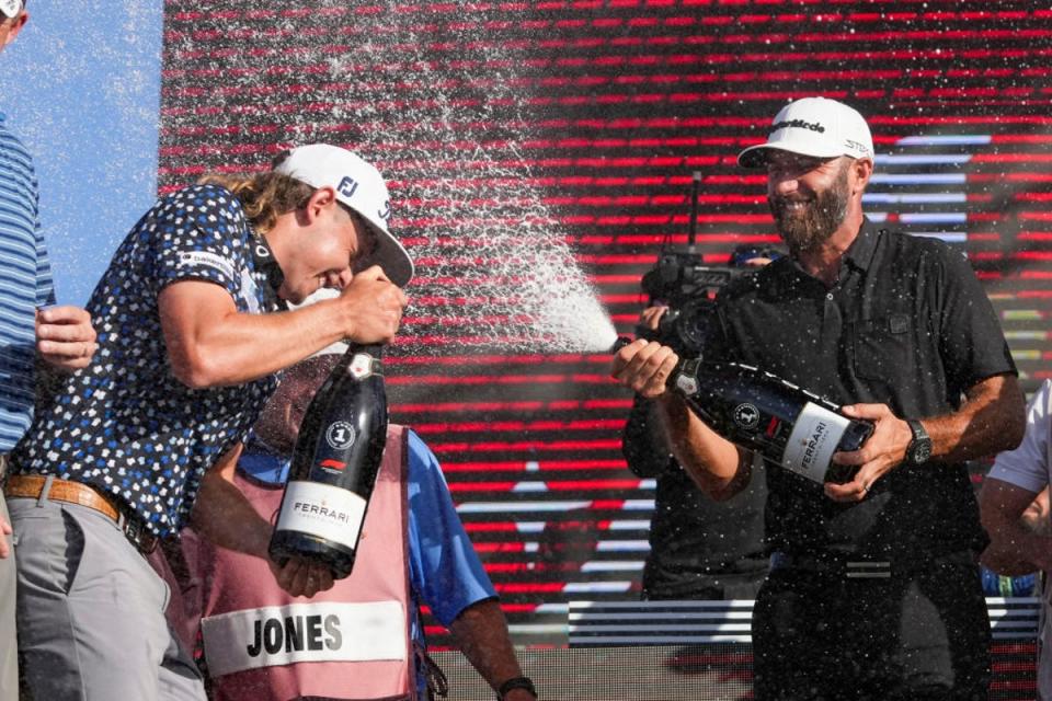 Cameron Smith and Dustin Johnson celebrate victory at last season’s Team Championship (Getty Images)