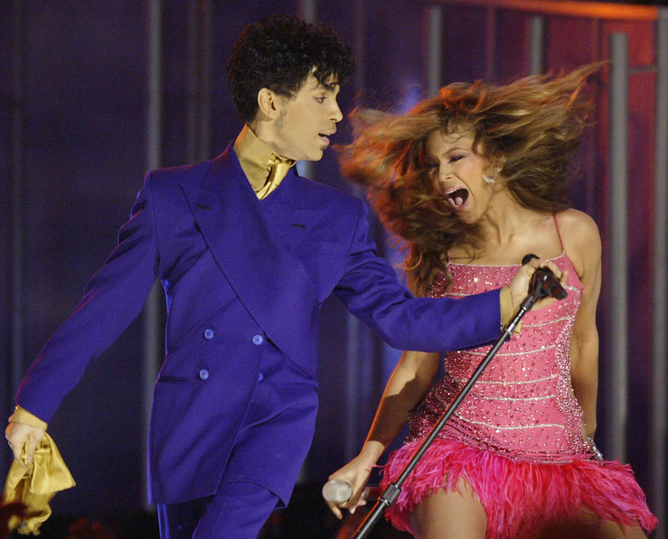 FILE- In this Feb. 8, 2004, file photo, Beyonce, right, and Prince perform during the 46th Annual Grammy Awards in Los Angeles. The two were paired together by long-time Grammys producer Ken Ehrlich, who hangs up his producer hat on Sunday. (AP Photo/Kevork Djansezian, File)