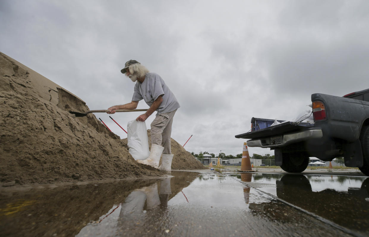 Bubby Longo fills sandbags in the old Kmart/Sears parking lot ahead of Tropical Storm Francine, Monday, Sept. 9, 2024, in Chalmette, La. (David Grunfeld/The Times-Picayune/The New Orleans Advocate via AP)