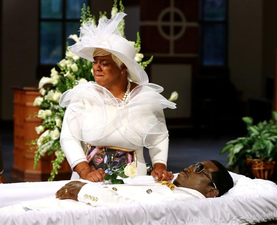 <div class="inline-image__caption"><p>Tomika Miller, the widow of Rayshard Brooks, who was shot dead June 12 by an Atlanta police officer, cried over his coffin at the conclusion of his public viewing a day before his funeral at Ebenezer Baptist Church in Atlanta, Georgia, U.S. June 22, 2020.</p></div> <div class="inline-image__credit">Curtis Compton/Pool via Reuters</div>
