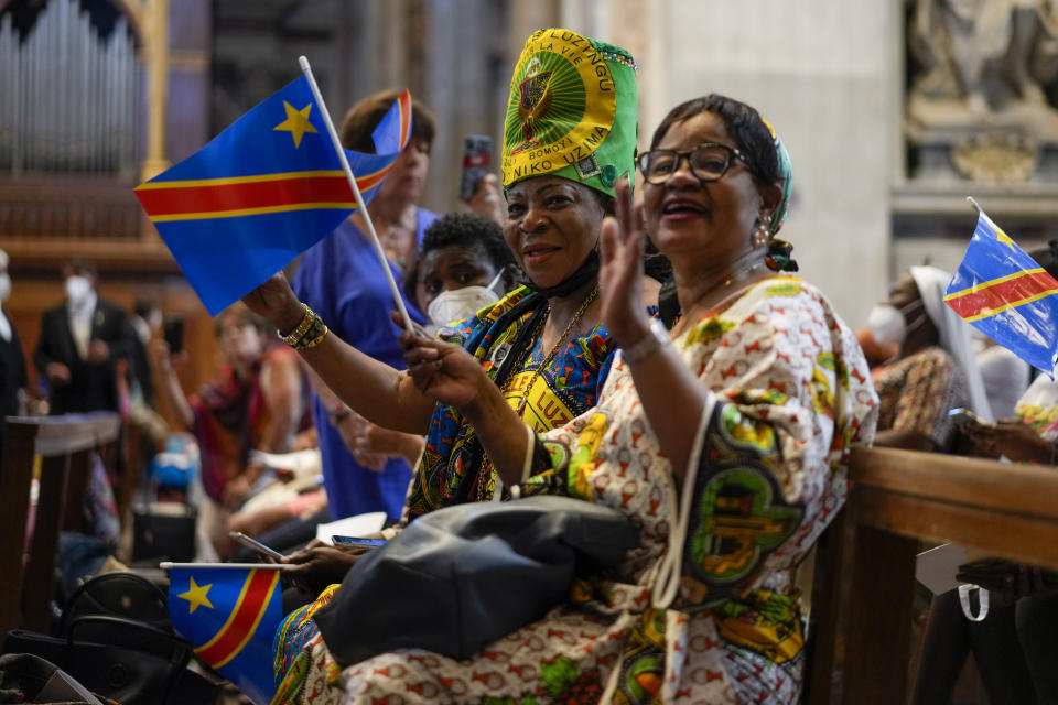 Faithful wait for the arrival of Pope Francis to celebrate a mass for the Congolese community, in St. Peter's Basilica at the Vatican, Sunday, July 3, 2022. (AP Photo/Andrew Medichini)