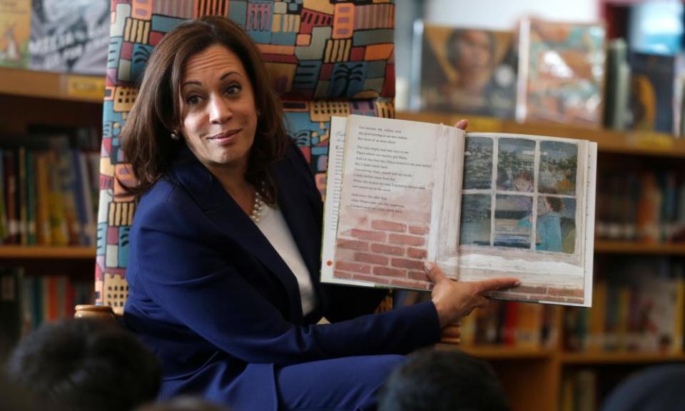 Kamala Harris reads a book about kindness to students at an elementary school in Dearborn, Michigan.