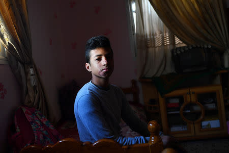 Moatasem Al-Nabeeh, 14, who is diagnosed with cancer, poses during an interview with Reuters at his home in Gaza City, February 12, 2019. REUTERS/Dylan Martinez