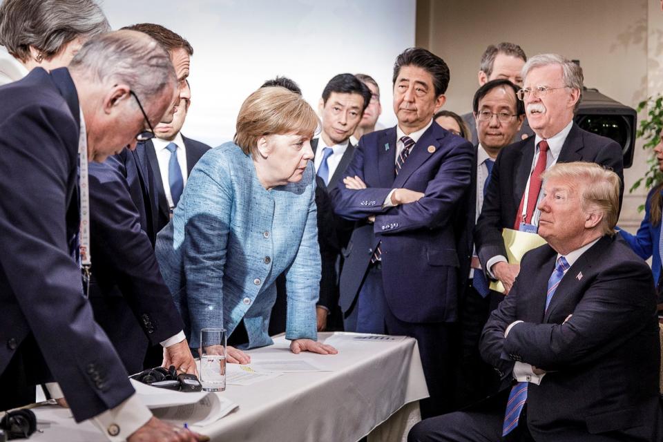 German Chancellor Angela Merkel speaks to US President Donald Trump at the G7 meeting (Reuters)