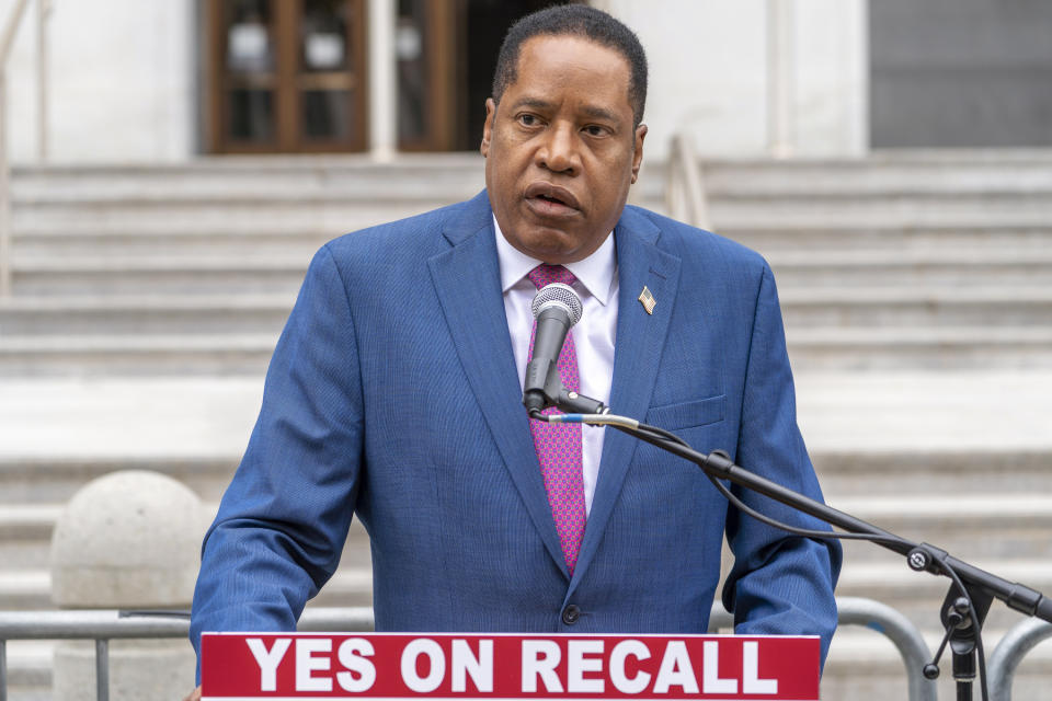 Conservative radio talk show host Larry Elder speaks to supporters during a campaign stop outside the Hall of Justice downtown Los Angeles Thursday, Sept. 2, 2021. Elder is running to replace Democratic Gov. Gavin Newsom in the Sept. 14 recall election. Democrats have an early edge in the California recall election that could remove Democratic Gov. Gavin Newsom from office. State figures show Democrats are returning mail-in ballots at more than twice the rate submitted by Republicans. (AP Photo/Damian Dovarganes)