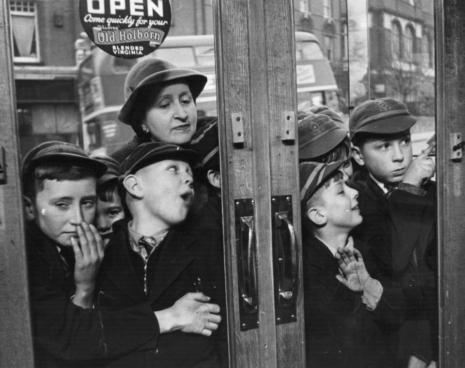 Children outside a sweet shop, 1953  - Grace Robertson/Picture Post/Hulton Archive/Getty