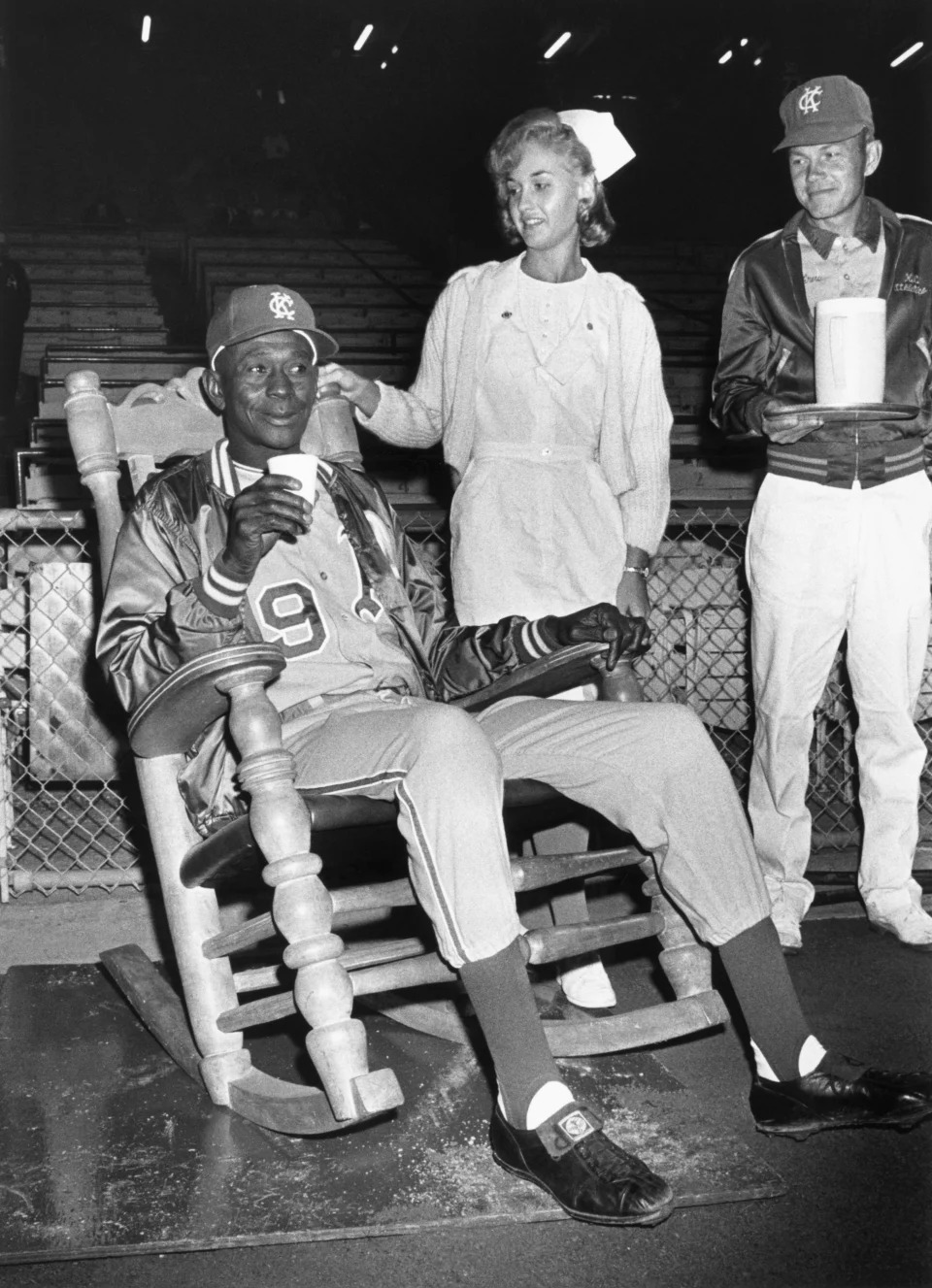 Paige watches a game from a rocking chair days before taking the mound. (Bettmann Archives/Getty Images)