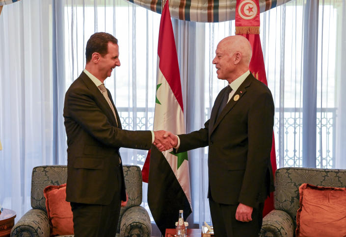 In this photo provided by the Tunisian Presidency, Tunisian President Kais Saied, right, shakes hand with Syrian President Bashar Assad, in Jeddah, Saudi Arabia, during the Arab summit, Friday, May 19, 2023. (Slim Abid/Tunisian Presidency via AP)