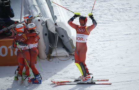 Alpine Skiing - Pyeongchang 2018 Winter Olympics - Team Event - Yongpyong Alpine Centre - Pyeongchang, South Korea - February 24, 2018 - Leif Kristian Nestvold-Haugen of Norway and teammates celebrate winning bronze. REUTERS/Mike Segar