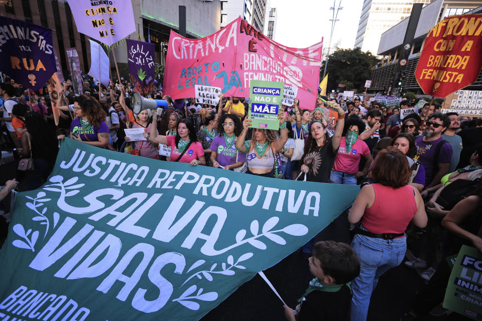 Abortion rights activists march against an anti-abortion congressional bill, along Paulista Avenue in Sao Paulo, Saturday, June 15, 2024. (AP Photo/Ettore Chiereguini)