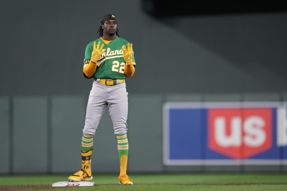 Oakland Athletics' Lawrence Butler signals to the dugout after hitting a double against the Minnesota Twins during the third inning of a baseball game Wednesday, Sept. 27, 2023, in Minneapolis. (AP Photo/Abbie Parr)