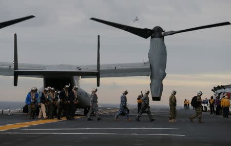 Participants in a ceremony marking the start of Talisman Saber 2017, a biennial joint military exercise between the United States and Australia, arrive on a U.S. Marines MV-22B Osprey Aircraft on the deck of the USS Bonhomme Richard amphibious assault ship off the coast of Sydney, Australia, June 29, 2017. REUTERS/Jason Reed