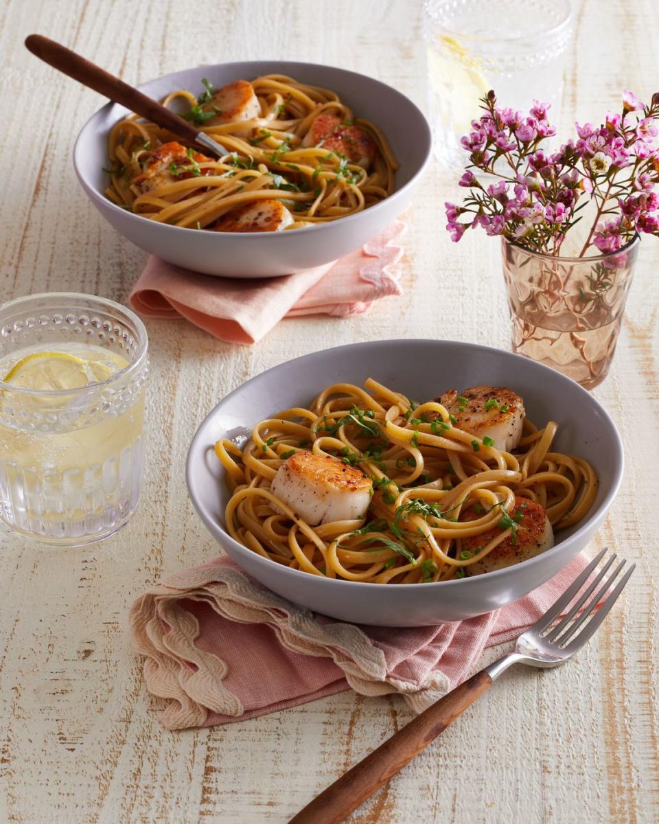 two bowls of linguine with scallops