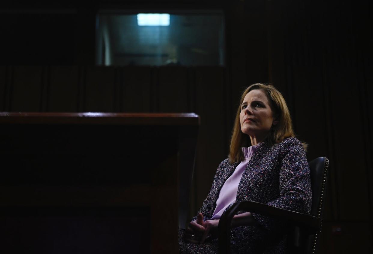 <span class="caption">Amy Coney Barrett testifies before the Senate.</span> <span class="attribution"><a class="link " href="https://www.gettyimages.com/detail/news-photo/supreme-court-nominee-judge-amy-coney-barrett-testifies-news-photo/1229075569?adppopup=true" rel="nofollow noopener" target="_blank" data-ylk="slk:Andrew Caballero-Reynolds Pool/Getty Images;elm:context_link;itc:0;sec:content-canvas">Andrew Caballero-Reynolds Pool/Getty Images</a></span>