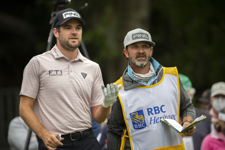 Corey Conners, of Canada, plans his shot with his caddie Danny Sahl, right, the ninth tee during the second round of the RBC Heritage golf tournament in Hilton Head Island, S.C., Friday, April 16, 2021. (AP Photo/Stephen B. Morton)