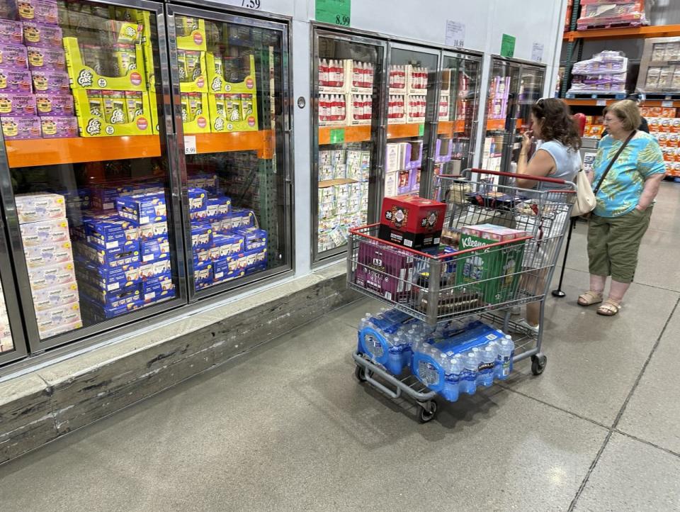 Costco keeps operating costs low by running no-frills warehouses with a limited number of products displayed on pallets in large quantities.