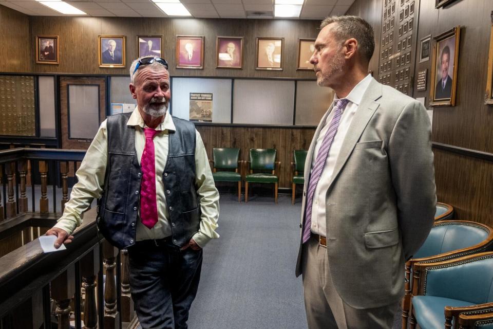 Ricky Davis, left, speaks with El Dorado County Dist. Atty. Vern Pierson in court Friday.