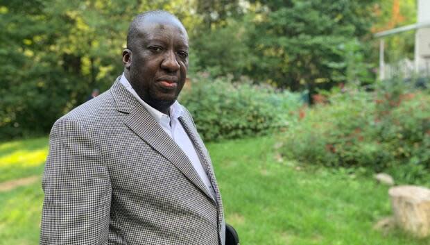 The charge of violating New Brunswick&#39;s Emergency Measures Act has been withdrawn against Dr. Jean-Robert Ngola, who now practices in Quebec. He was charged for not quarantining after he travelled from New Brunswick to Quebec last May and tested positive for the coronavirus a few days after his return. (Judy Trinh/CBC News file photo - image credit)