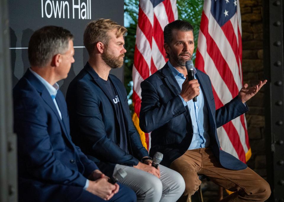 Rep. Jim Banks (left), Michael Seifert, and Donald Trump Jr., in Indianapolis on Monday, Nov. 6, 2023, during a town hall-style meeting to discuss PublicSquare, which dubs itself as an “anti-woke” shopping app. Rep. Jim Banks is seeking a U.S. Senate seat during the Nov. 7 elections.