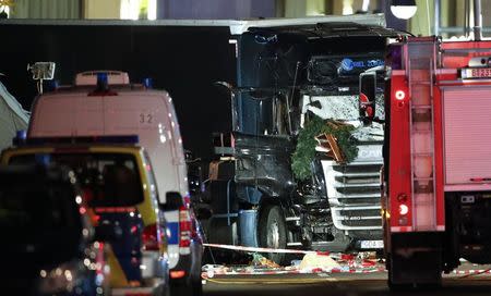 Parts of a Christmas market decoration stick in the windscreen of a truck following an accident with the truck on Breitscheidplatz square near the fashionable Kurfuerstendamm avenue in the west of Berlin, Germany, December 19, 2016. REUTERS/Fabrizio Bensch