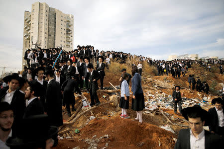 Ultra-Orthodox Jews gather during the funeral ceremony of prominent spiritual leader Rabbi Aharon Yehuda Leib Steinman, who died on Tuesday at the age of 104, in Bnei Brak near Tel Aviv, Israel December 12, 2017. REUTERS/Amir Cohen