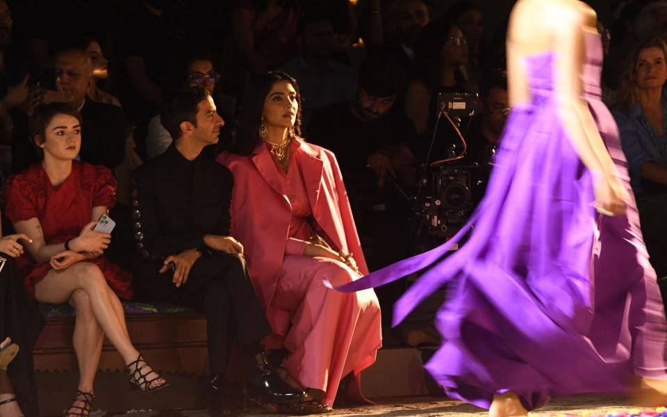 Maisie Williams and Sonam Kapoor on the front row at the Dior Mumbai show - Getty 