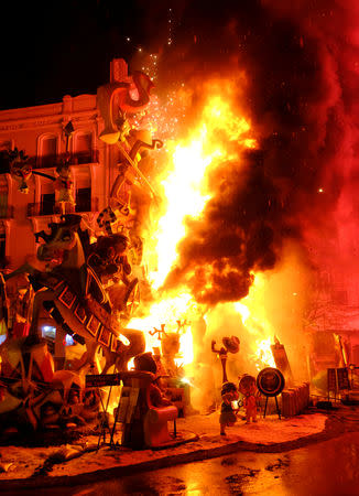 Figures of a Fallas monument burn during the finale of the Fallas festival, which welcomes Spring and commemorates Saint Joseph's Day, in Valencia early March 20, 2019. REUTERS/Heino Kalis