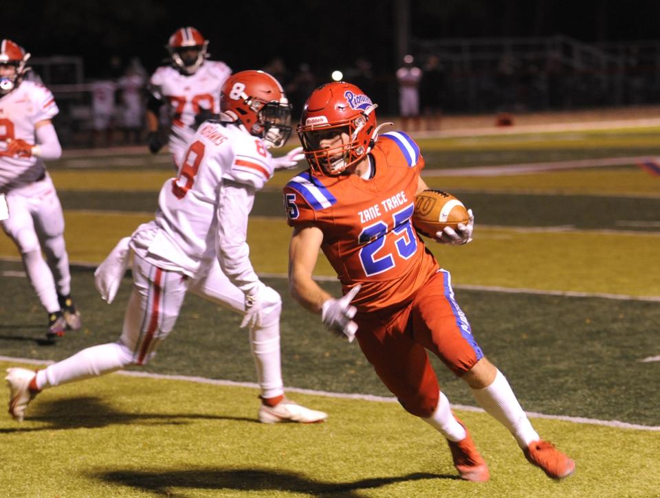 Zane Trace's Riley Hartsaugh (#25) moves downfield during the Pioneers' game against the Madison Mohawks in the first round of the Division V, Region 20 playoffs on Oct. 27, 2023, in Kinnikinnick, Ohio. Zane Trace won the game 24-14.