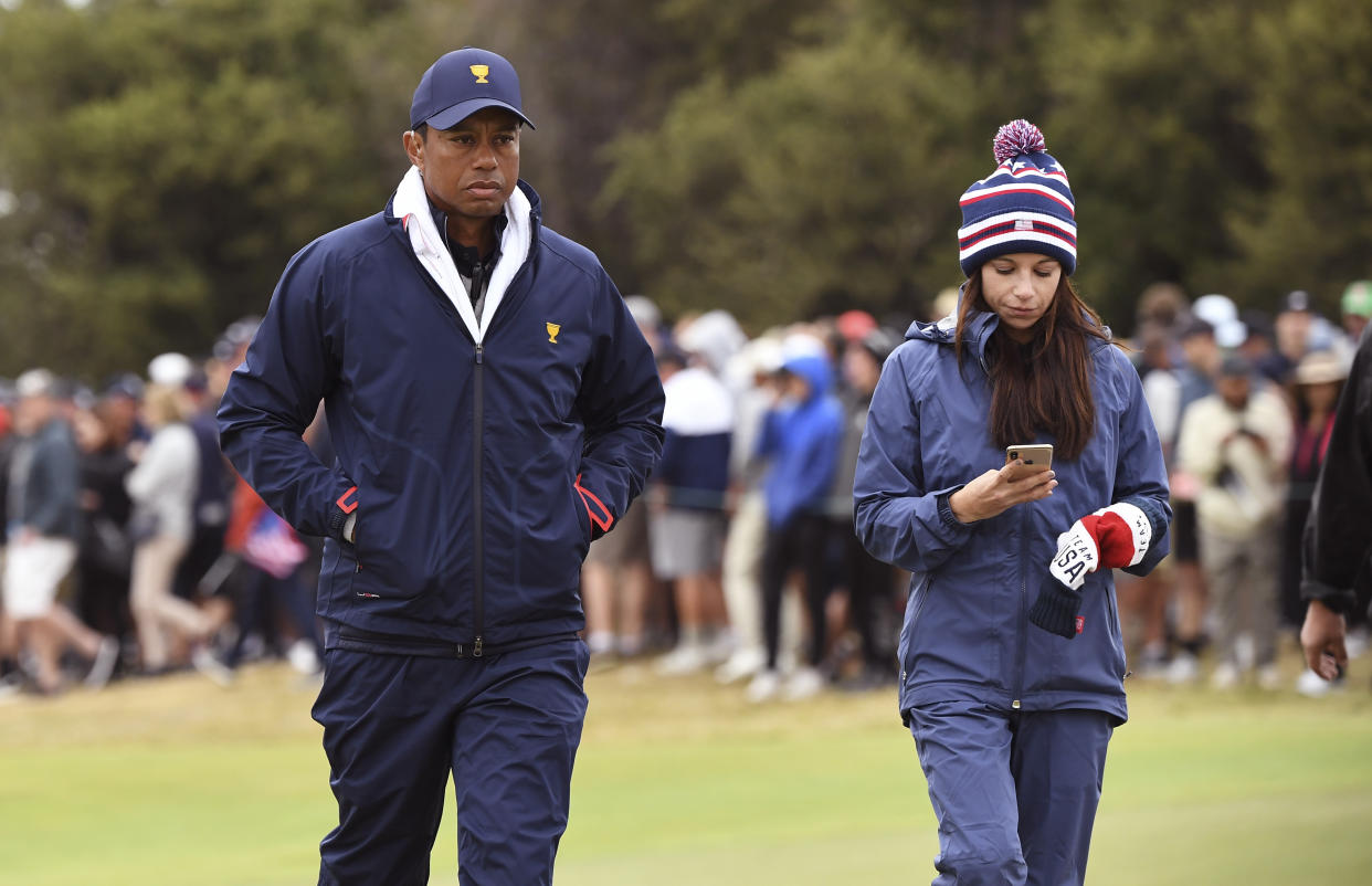 Tiger Woods and Erica Herman, seen here at the Presidents Cup in 2019, are now embroiled in a legal dispute. (William West / AFP via Getty Images)