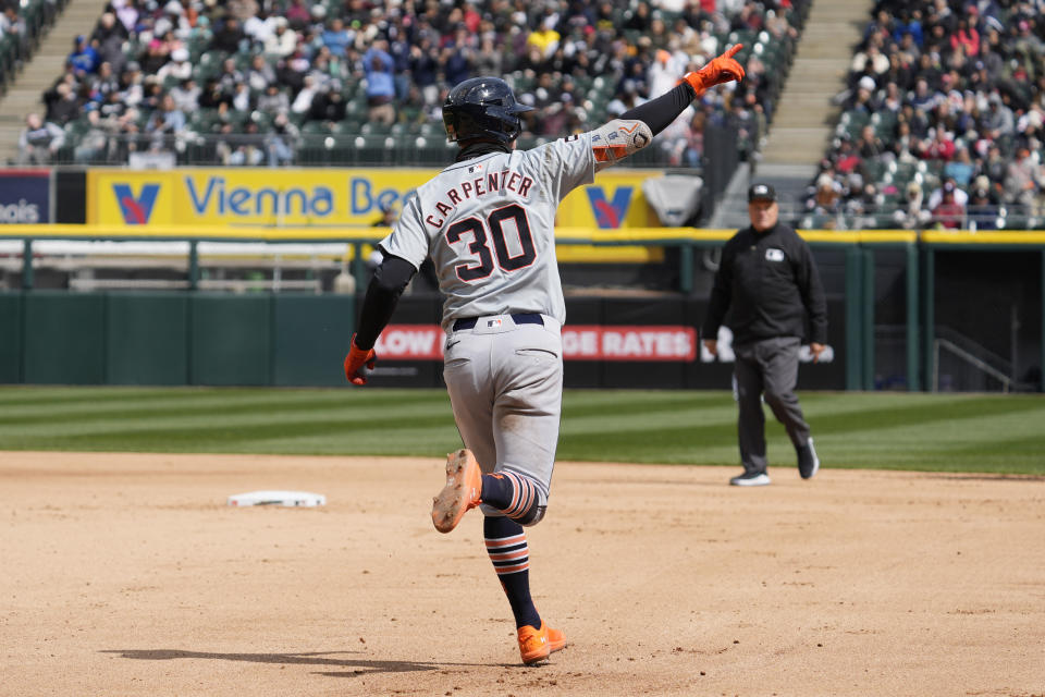 Detroit Tigers' Kerry Carpenter celebrates as he rounds the bases after hit a solo home run during the fourth inning of a baseball game against the Chicago White Sox in Chicago, Sunday, March 31, 2024. (AP Photo/Nam Y. Huh)