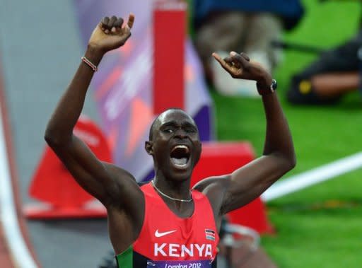 Kenya's David Rudisha celebrates after winning the men's 800 final at the athletics event during the London 2012 Olympic Games on August 9, 2012 in London in world record time