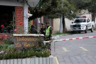 Policemen are seen at the entrance of the Urbanizacion La Rinconada, where the residence of Mexico's ambassador is located, in La Paz