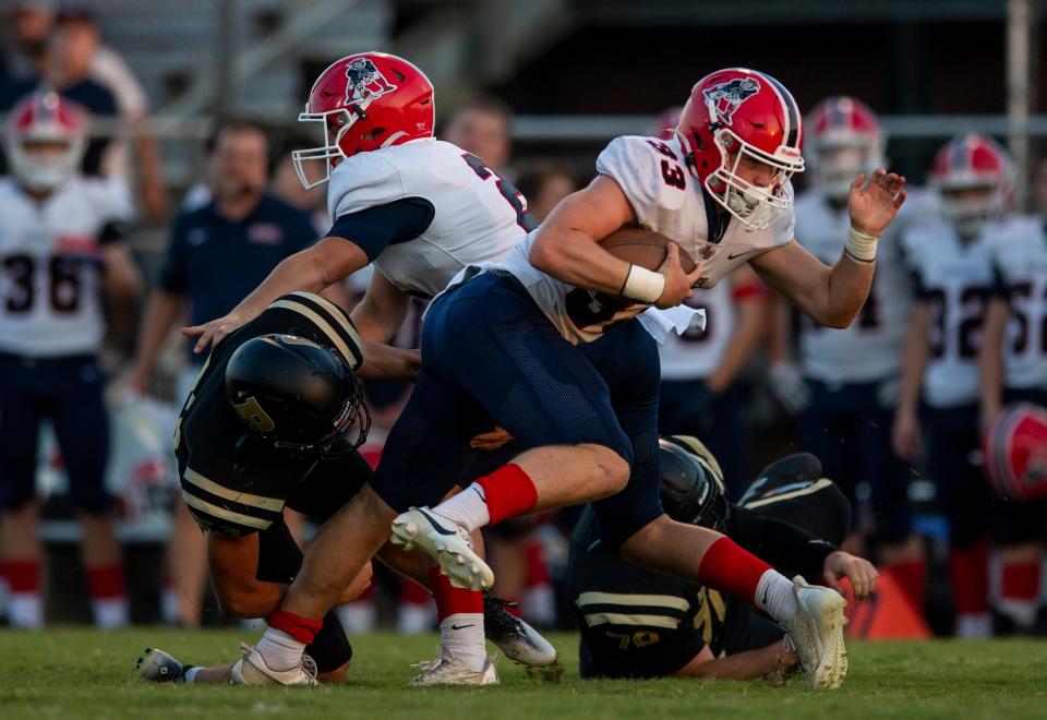 Heritage Hills' Braydon Durham (33) carries the ball as the Heritage Hills Patriots play the Boonville Pioneers Friday, Sept. 1, 2023.