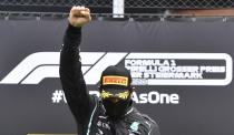 Mercedes driver Lewis Hamilton of Britain celebrates on the podium after winning the Styrian Formula One Grand Prix at the Red Bull Ring racetrack in Spielberg, Austria, Sunday, July 12, 2020. (Joe Klamar/Pool via AP)