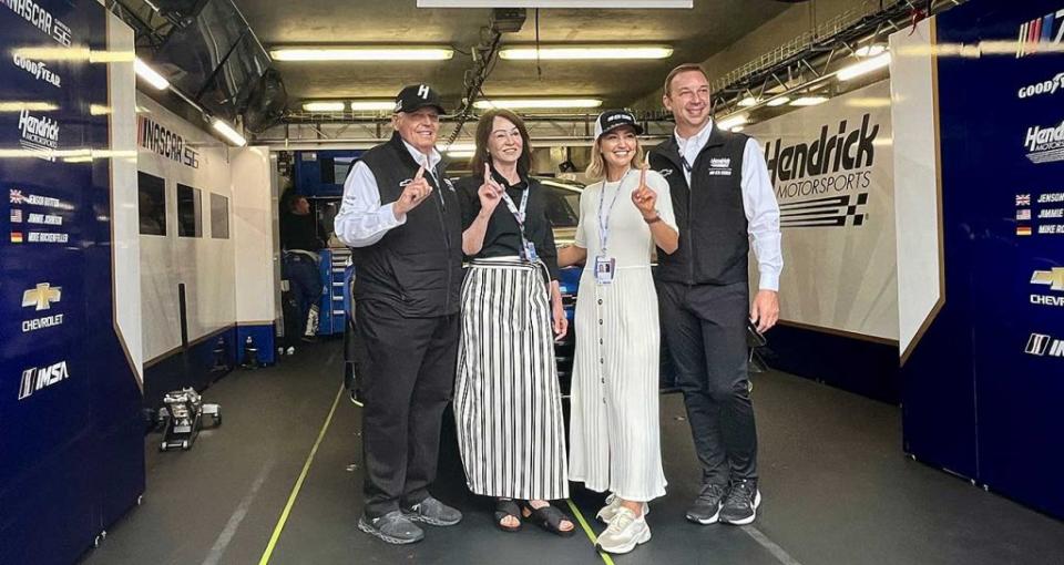From left: Rick and Linda Hendrick, and Chad and Brooke Knaus pose or pictures in the Garage 56 pit stall.