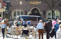 <p>People stay in front of the Grosser Kiepenkerl restaurant in Muenster, Germany, Saturday, April 7, 2018 after a vehicle crashed into a crowd. (Photo: Stephan R./dpa via AP) </p>