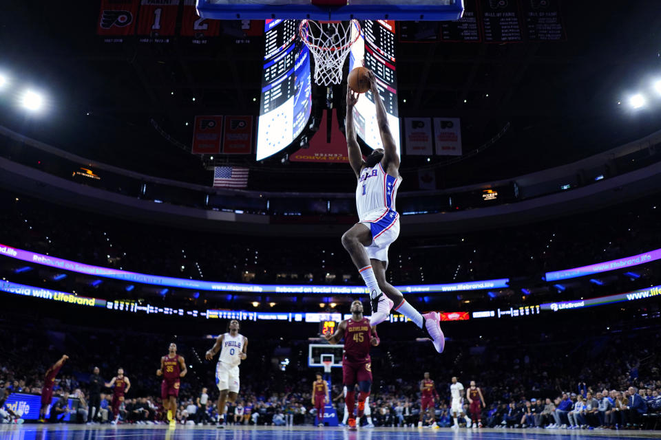 Philadelphia 76ers' James Harden goes up for a dunk during the first half of a preseason NBA basketball game against the Cleveland Cavaliers, Wednesday, Oct. 5, 2022, in Philadelphia. (AP Photo/Matt Slocum)