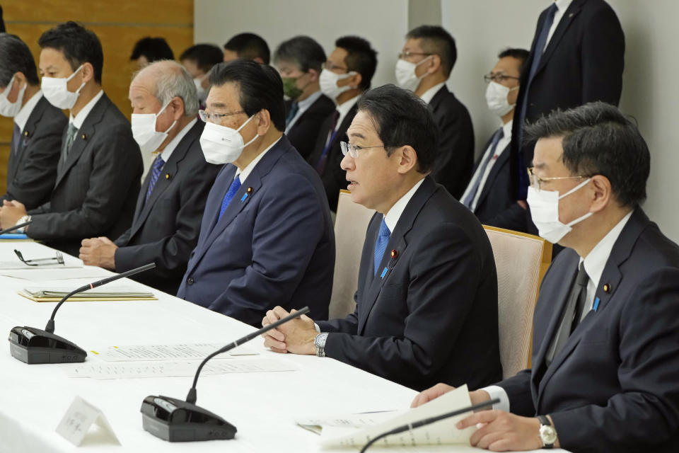 Japanese Prime Minister Fumio Kishida, second right, speaks during a policy meeting at his office in Tokyo Friday, Oct. 28, 2022. Kishida’s government was to approve on Friday a hefty economic package that will include government funding of about 29 trillion yen ($200 billion) to soften the burden of costs from rising utility rates and food prices. (Keisuke Hosojima/Kyodo News via AP)