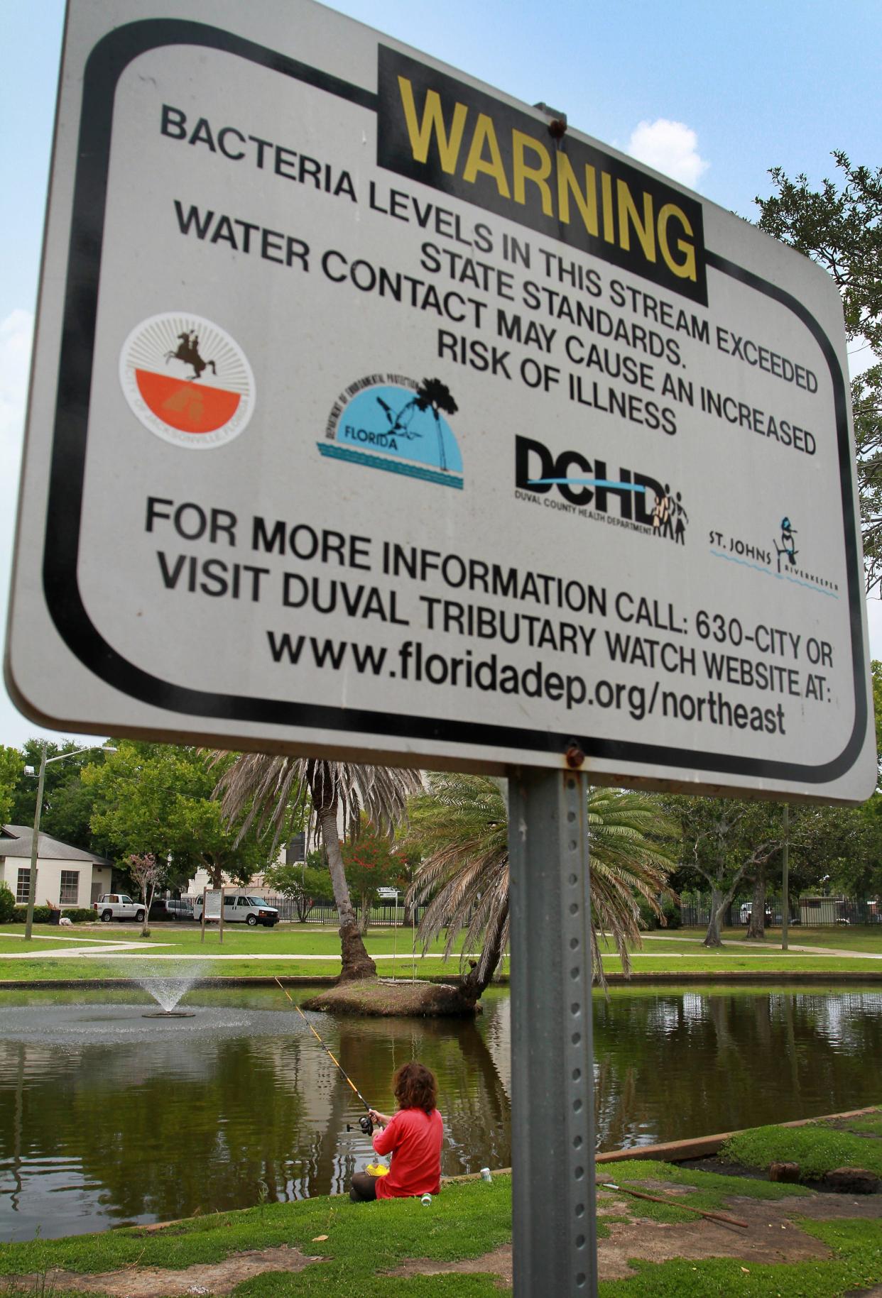 A sign at Jacksonville's Springfield Park warns against bacteria levels in Hogans Creek in this 2011 photo.