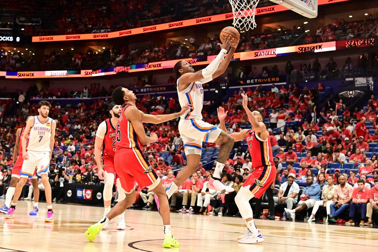 Apr 27, 2024; New Orleans, Louisiana, USA;Oklahoma City Thunder Forward Jalen Williams (8) goes up for a shot while defended by New Orleans Pelicans Guard Trey Murphy III (25) and New Orleans Pelicans Forward Naji Marshall (8) during the fourth quarter of game three of the first round for the 2024 NBA playoffs at Smoothie King Center. Mandatory Credit: Matt Bush-USA TODAY Sports ORG XMIT: IMAGN-878062 ORIG FILE ID: 2024427_rtc_mb6_0513.JPG