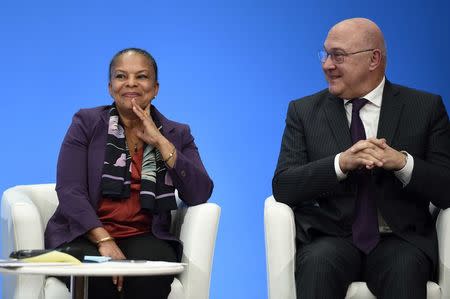 French Justice minister Christiane Taubira (L) and Finance minister Michel Sapin attend a press conference to present reform proposals, agreed by the government today, at the Elysee Palace in Paris, France, December 23, 2015. REUTERS/Eric Feferberg/Pool