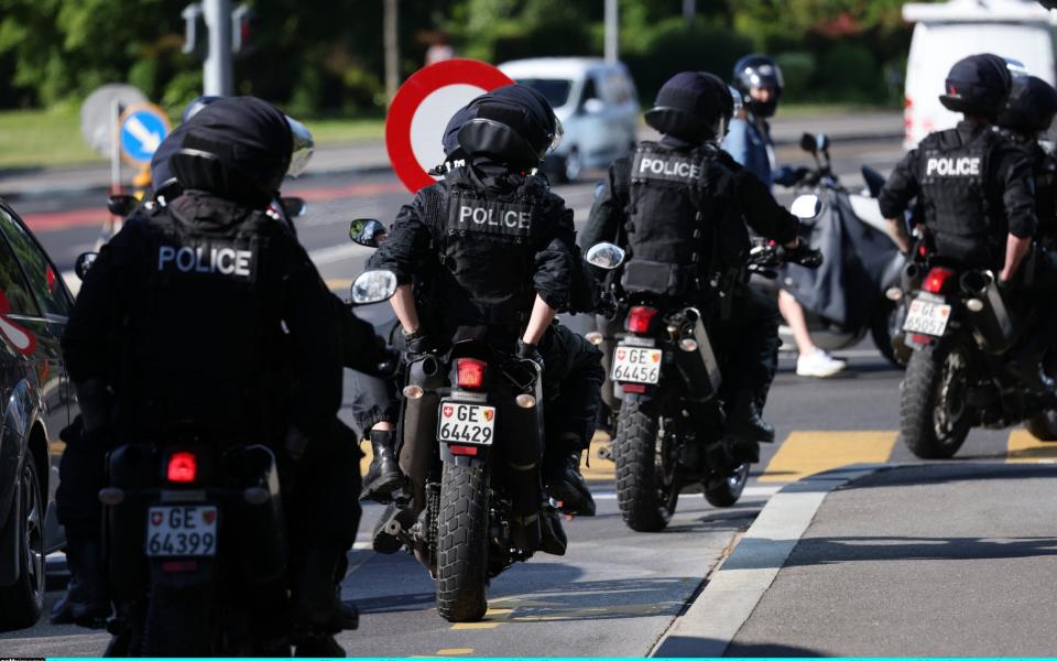 Police officers travel to the Intercontinental Hotel, Geneva, where Joe Biden is to arrive on Tuesday ahead of his summit with Vladimir Putin - Sean Gallup/Getty Images Europe