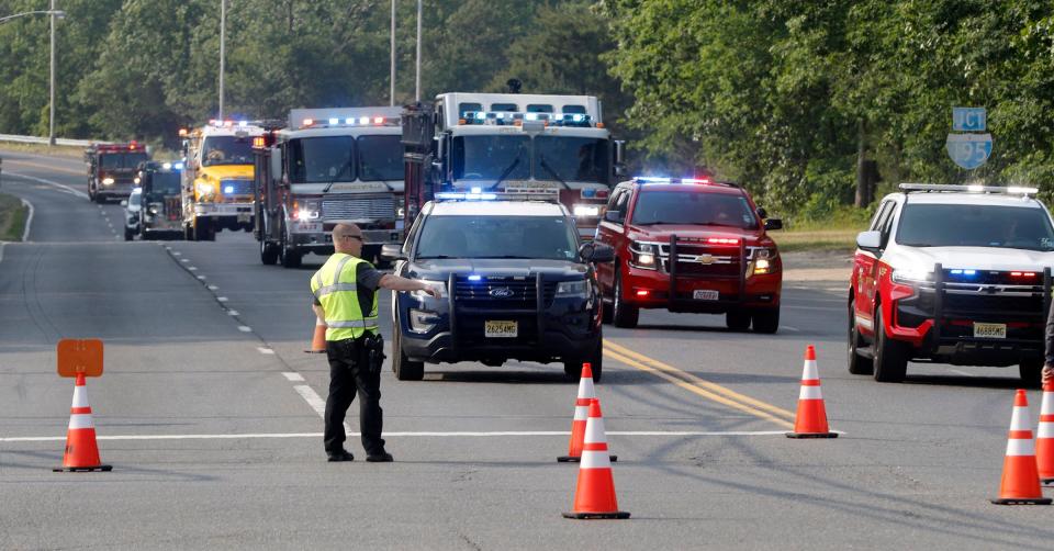 Fire vehicles roll through East Commodore Boulevard and Cedar Swamp Road in Jackson Township Tuesday evening, June 6, 2023, en route to a staging area for a nearby brush fire.