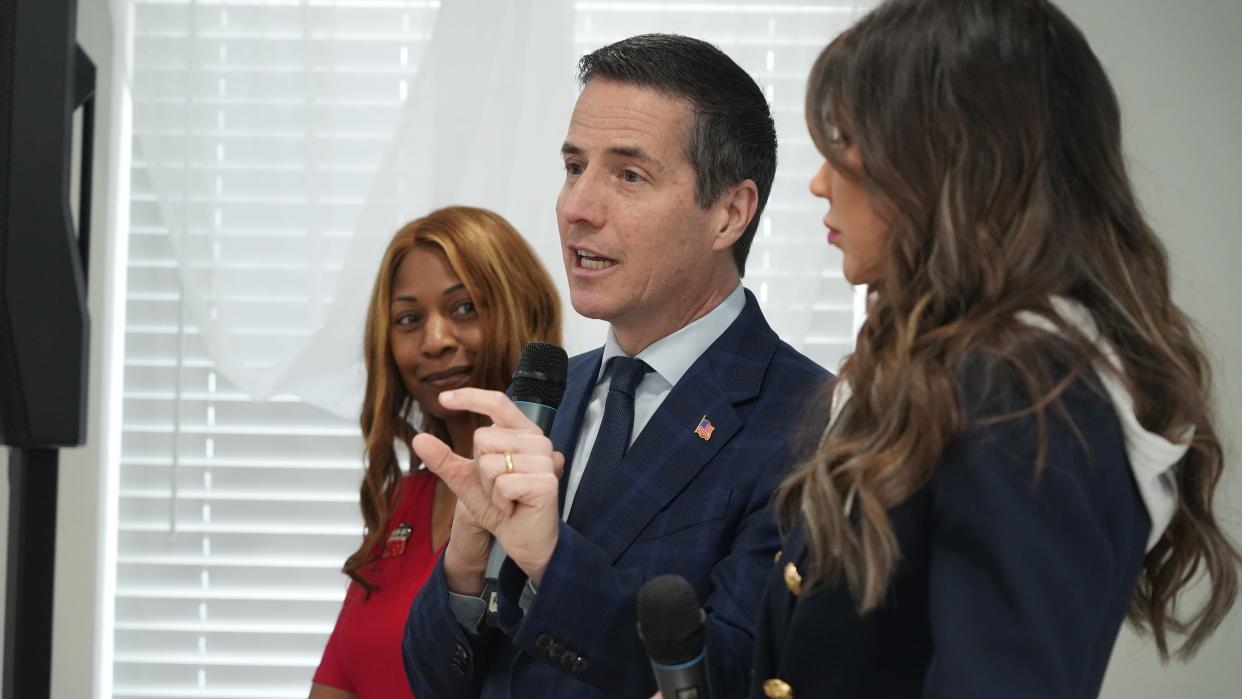 Mar 11, 2024; Columbus, Ohio, US; Flanked by state Sen. Michele Reynolds (left) and South Dakota Gov. Kristi Noem, Ohio Senate candidate and Cleveland businessman Bernie Moreno answers questions from the media after a campaign stop at the Destiny Center, 1561 Old Leonard Ave. on the Near East Side. The Republican candidate is facing a primary battle with State senator Matt Dolan and Secretary of State Frank LaRose.