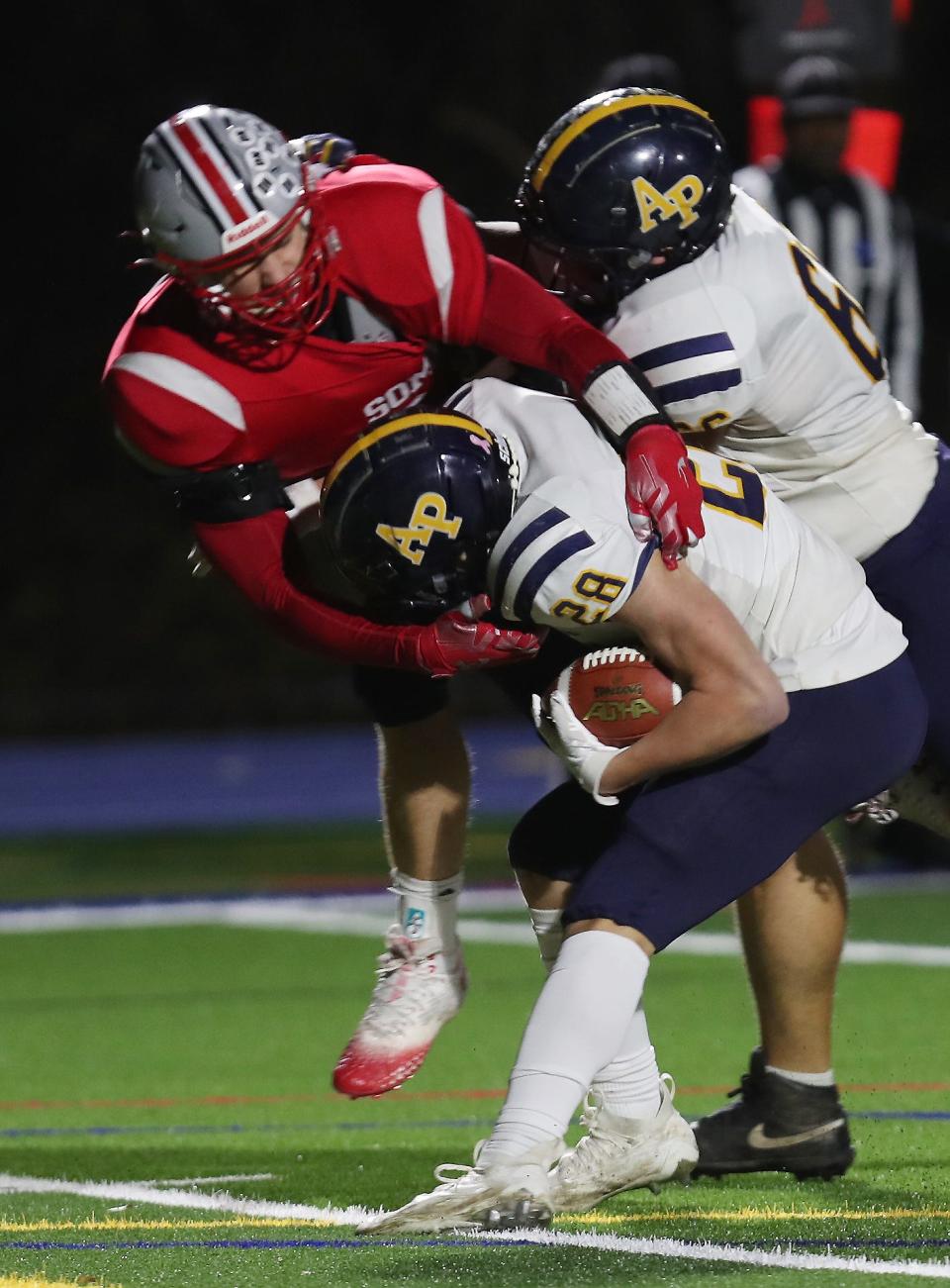 Somers Ryan Cole (99) tackles Averill Park's Drew Canaday (28) during the state Class A quarterfinal playoff game at Mahopac High School Nov. 17, 2023.