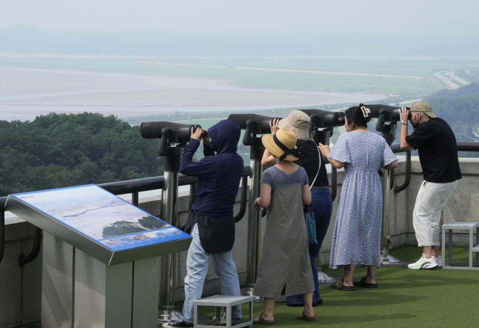 Visitors watch the North Korean side from the Unification Observation Post in Paju, South Korea, Thursday, July 20, 2023. North Korea wasn't responding Thursday to U.S. attempts to discuss the American soldier who bolted across the heavily armed border and whose prospects for a quick release are unclear at a time of high military tensions and inactive communication channels. (AP Photo/Ahn Young-joon)