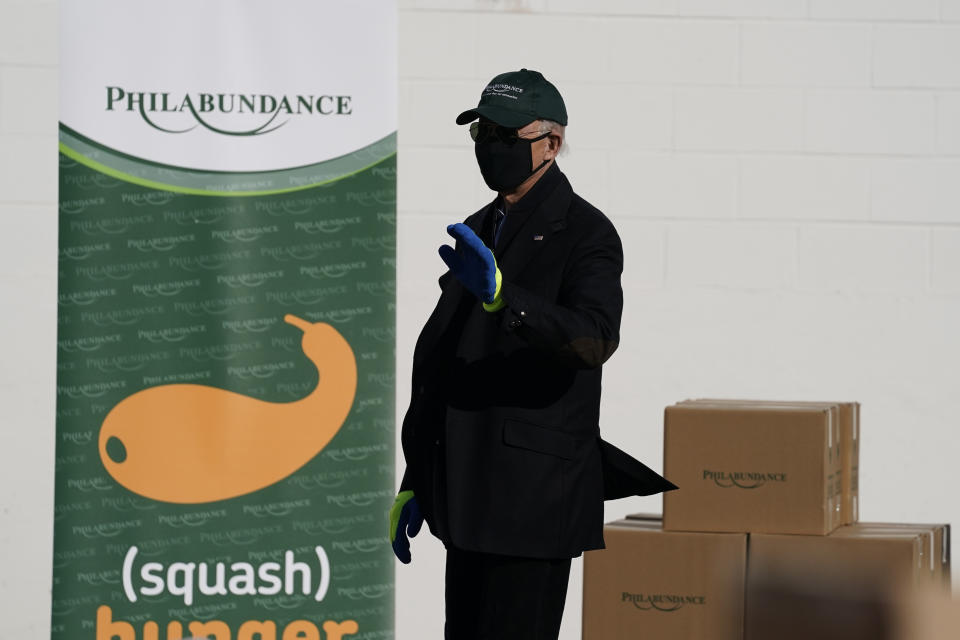 President-elect Joe Biden waves as he leaves after participating in a National Day of Service event at Philabundance, a hunger relief organization, Monday, Jan. 18, 2021, in Philadelphia. (AP Photo/Evan Vucci)