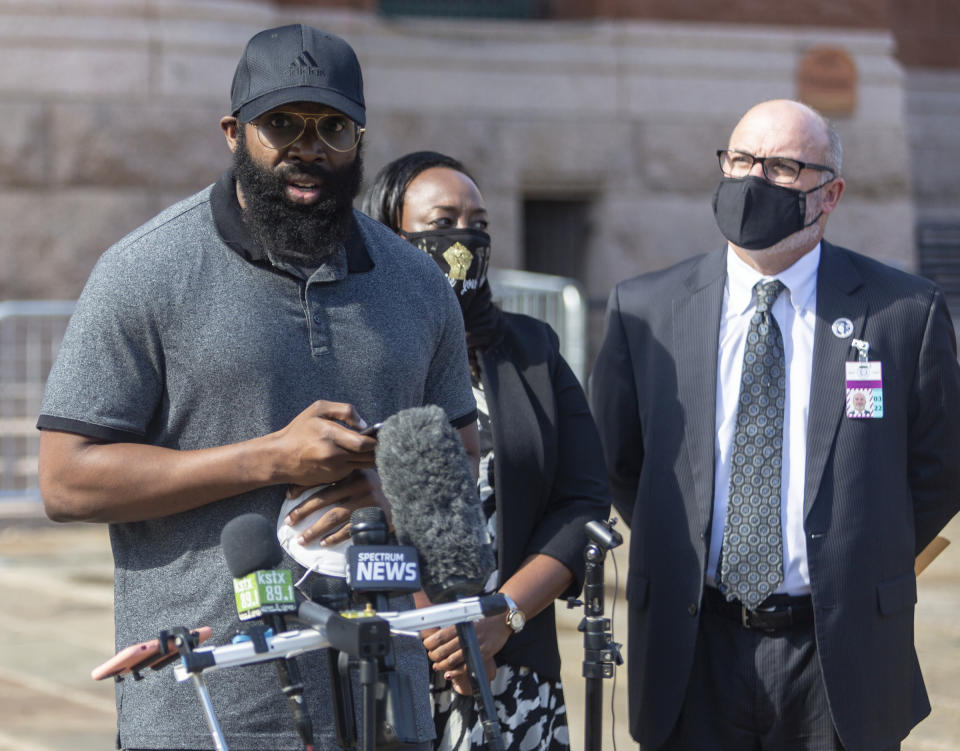 Mathias Ometu speaks outside the Bexar County Courthouse Wednesday, Sept. 2, 2020 to the media in San Antonio, Texas. Police officers detained Ometu while he was jogging, on Aug. 28 as a suspect in a nearby domestic violence call, saying he resembled a sketchy description given by the complainant. However, the complainant refused to come to the scene immediately to positively identify Ometu. The delay in his positive identification led to a two-day jail stay until he was cleared. (William Luther/The San Antonio Express-News via AP)